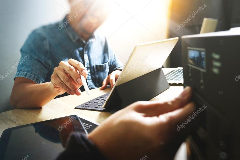 Website designer working digital tablet and computer laptop with