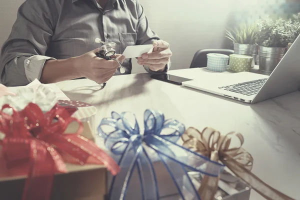 Gift giving,medical doctor Hand with credit card and hand with g