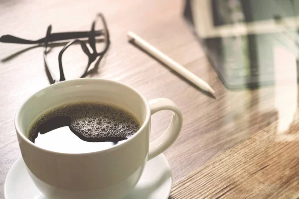 Coffee cup and Digital table dock smart keyboard,eyeglasses,styl — Stock Photo, Image