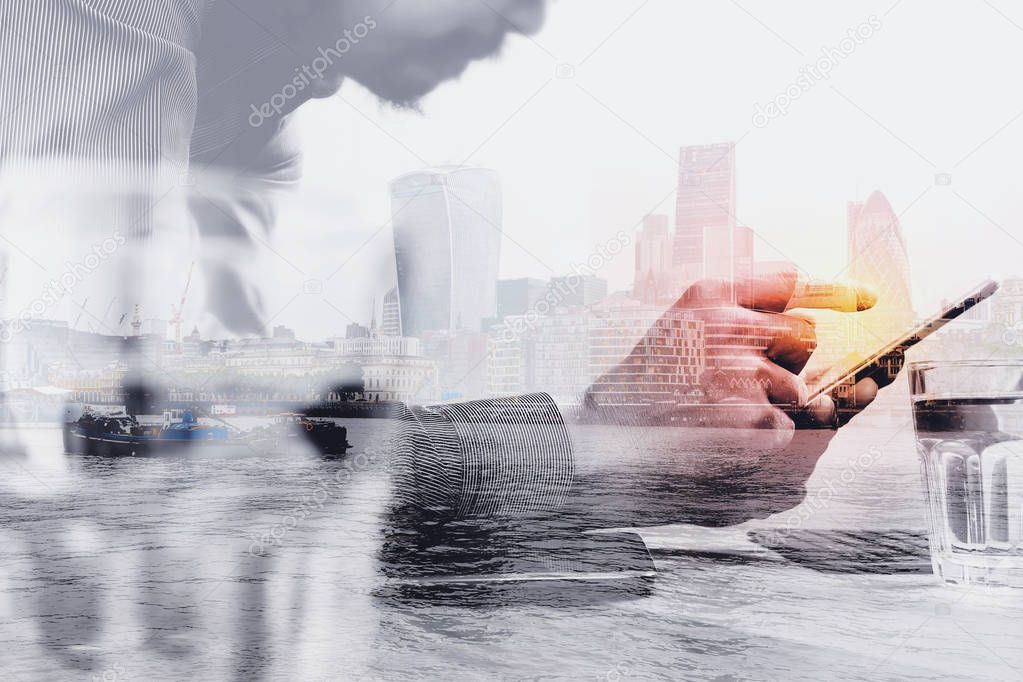 Double exposure of businessman hand using mobile payments online