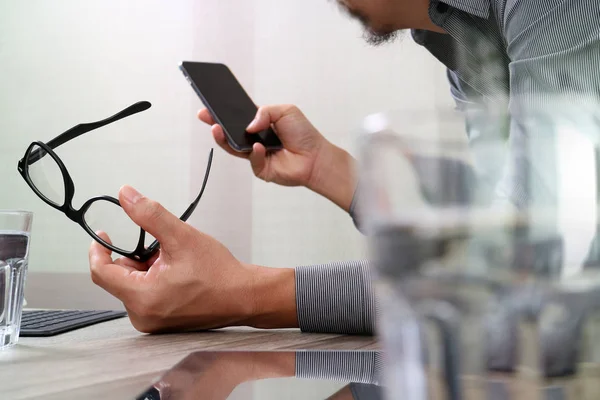 Businessman hand using mobile payments online shopping,pencil,om