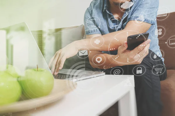 Designer man hand using laptop compter and mobile payments onlin — Stock Photo, Image