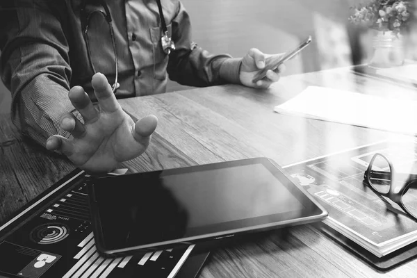 Doctor working with digital tablet computer with smart phone in — Stock Photo, Image