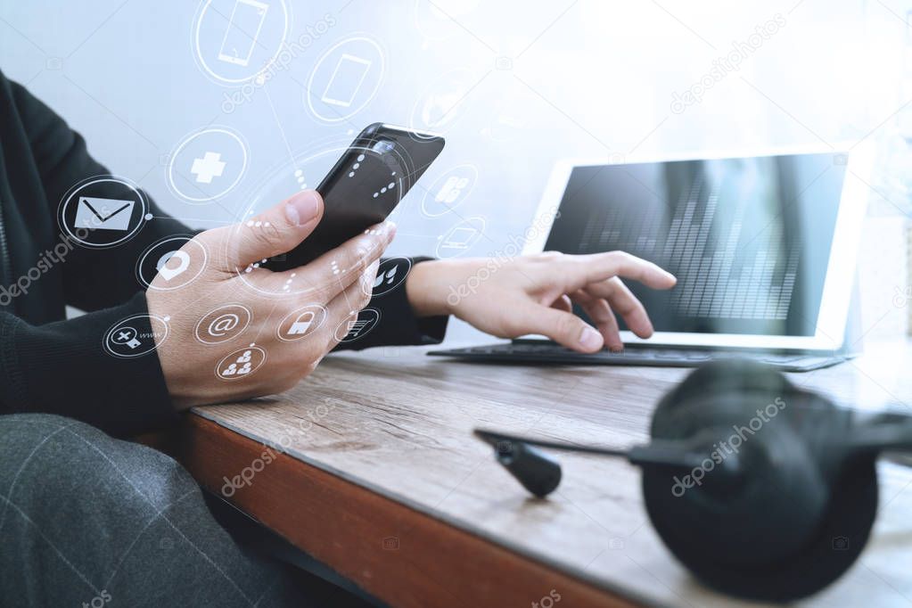 man hand using VOIP headset with digital tablet computer docking