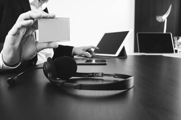 Man using VOIP headset and show id tag with digital tablet and l