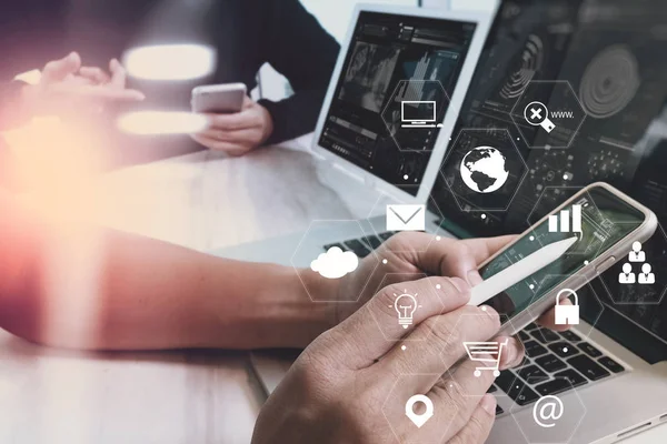 Businessman working with smart phone and laptop computer on wood — Stock Photo, Image