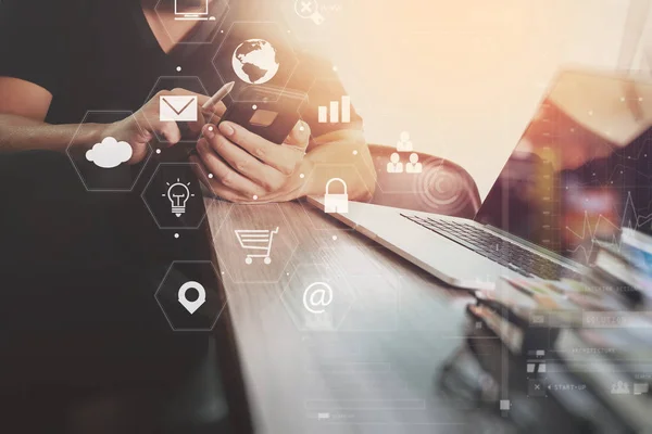 Businessman working with smart phone and laptop computer on wood — Stock Photo, Image