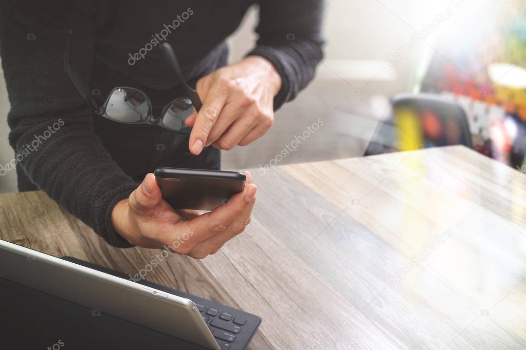 Businessman hand using mobile payments online shopping,omni chan