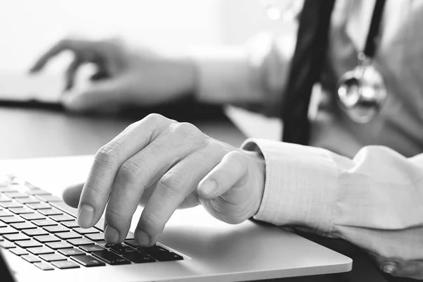 Close up of smart medical doctor working with laptop computer an — Stock Photo, Image