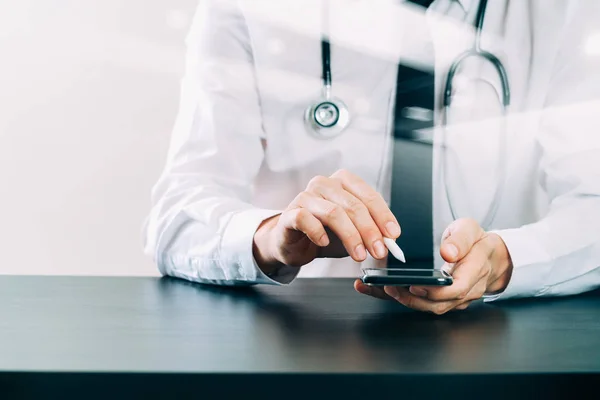 Close up of smart medical doctor working with smart phone and st — Stock Photo, Image