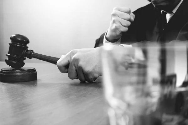 Justice and law concept.Male judge in a courtroom with the gavel — стоковое фото