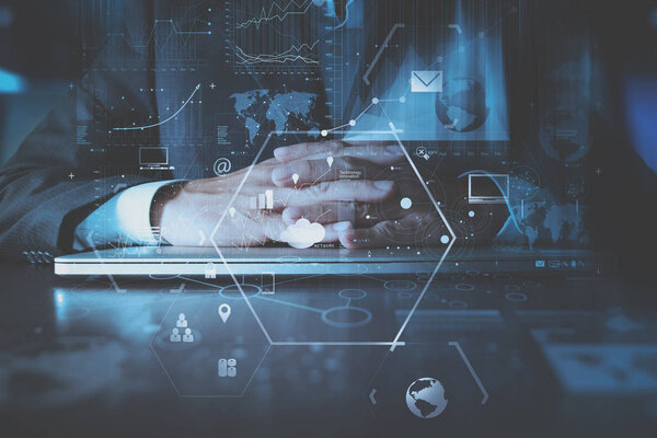 business man hand working with modern laptop computer in modern o
