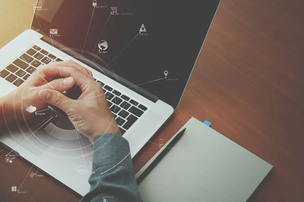 top view of  businessman hand working with laptop computer and b