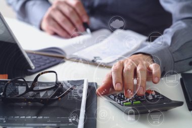 businessman hand working with finances about cost and calculator