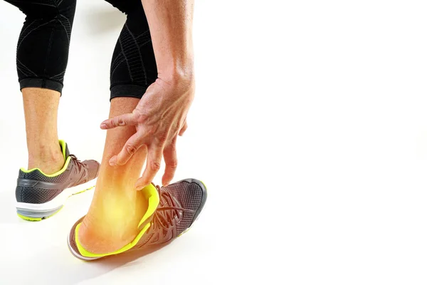 Runner sportsman holding ankle in pain with Broken twisted joint — Stock Photo, Image