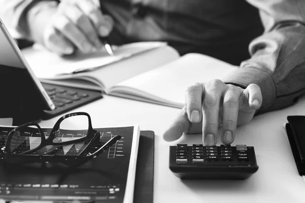 Businessman hand working with finances about cost and calculator — Stock Photo, Image