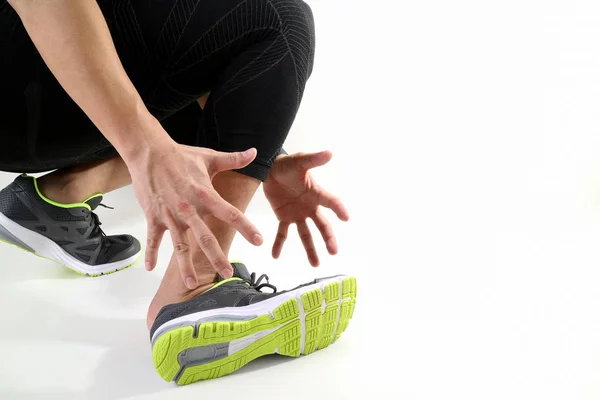 Runner sportsman holding ankle in pain with Broken twisted joint — Stock Photo, Image