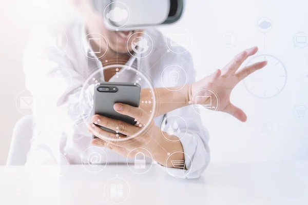 Businessman wearing virtual reality goggles in modern office wit — Stock Photo, Image