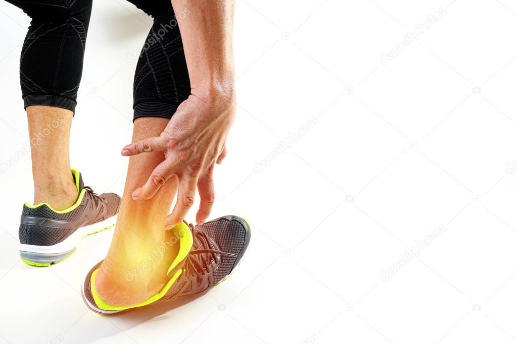 Runner sportsman holding ankle in pain with Broken twisted joint