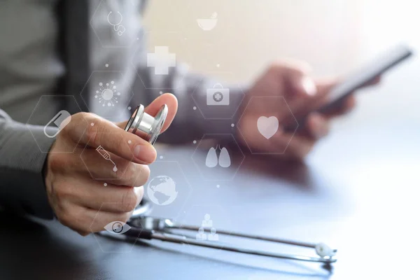 Close up of smart medical doctor working with stethoscope and mo — Stok Foto