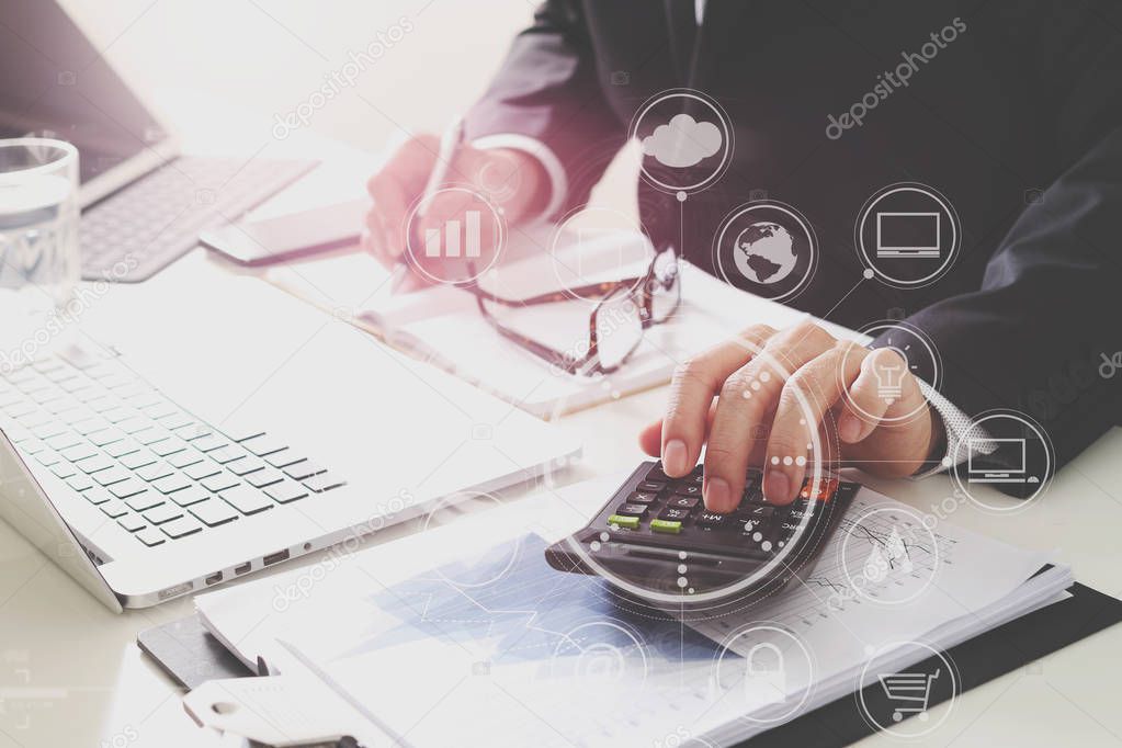 businessman hand working with finances about cost and calculator