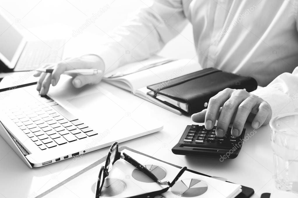 businessman hand working with finances about cost and calculate 