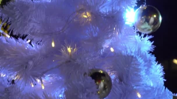 Gimbal Shot Ornaments Big Christmas Tree Decorative Light Falling Snow — стоковое видео