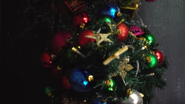 Gimbal Shot Ornaments Big Christmas Tree Decorative Light Falling Snow — стоковое видео