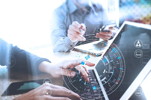 Businessmen working together on a document and using smart phone — Stock Photo, Image