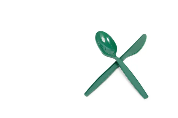 Green spoon and knife on white background — Stock Photo, Image