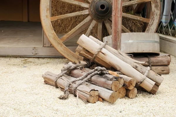 Stack of firewood on small rock — Stock Photo, Image