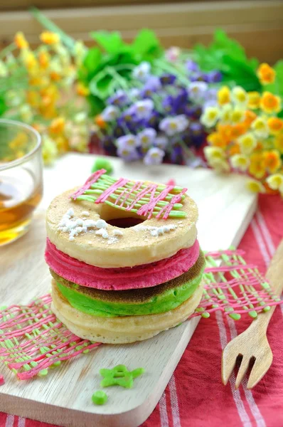 Stack of color pancake with honey and flower. — Stock Photo, Image