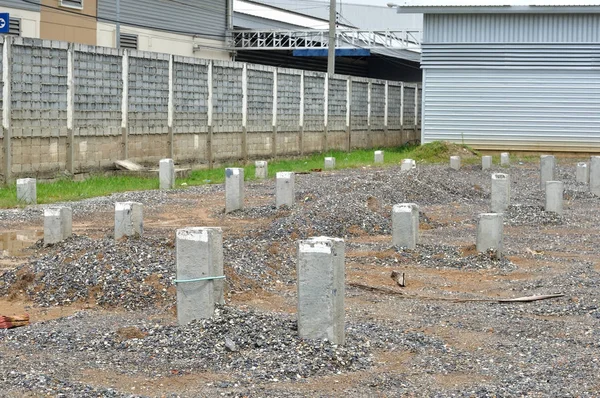 Construction area with concrete piles, building base — Stock Photo, Image
