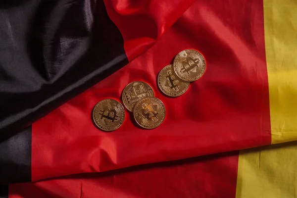 Golden bitcoins on german flag — Stock Photo, Image