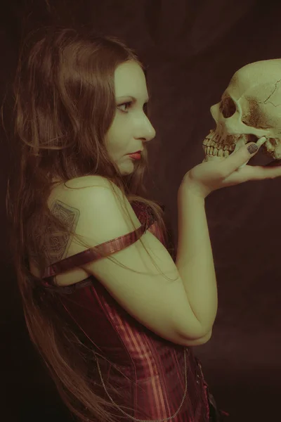 Pretty girl with skull — 스톡 사진