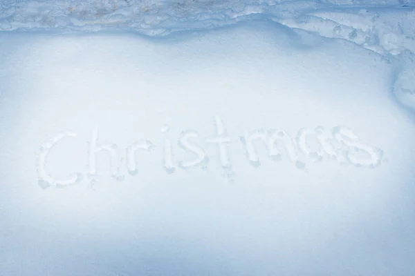 Julen handskriven på nysnö. — Stockfoto