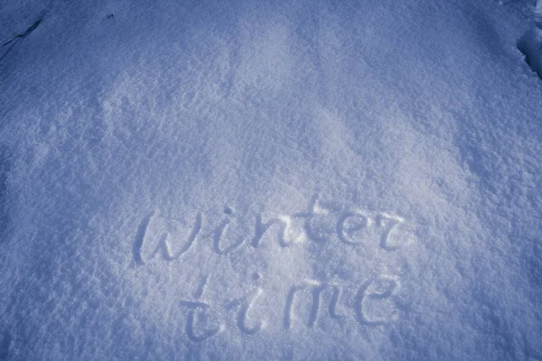 Invierno escrito a mano sobre nieve fresca — Foto de Stock