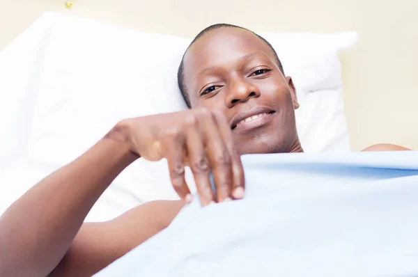 Young Man Lying Bed Ready Cover Smile Camera — Stock Photo, Image