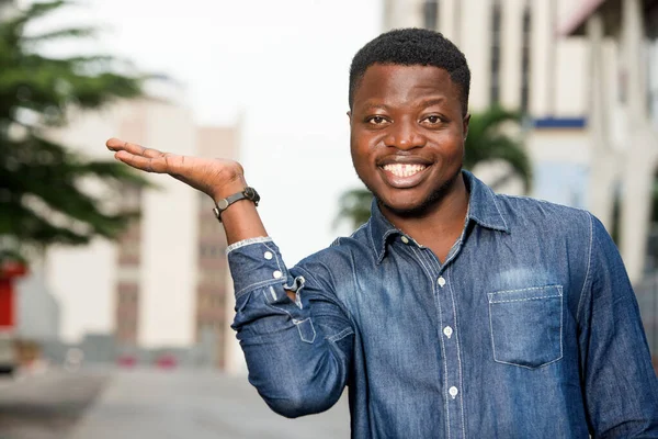 happy man in shirt gesturing a welcome sign