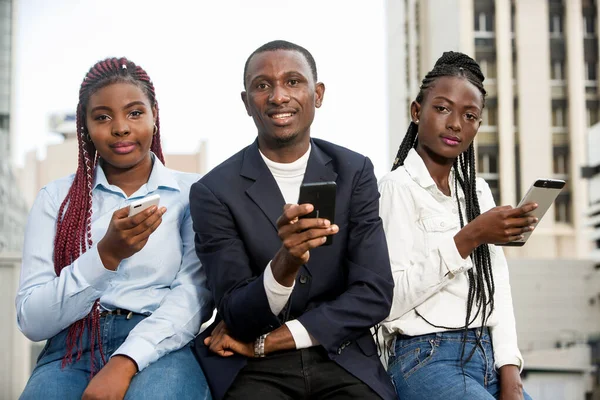 A group of business people around cell phones — Stock Photo, Image
