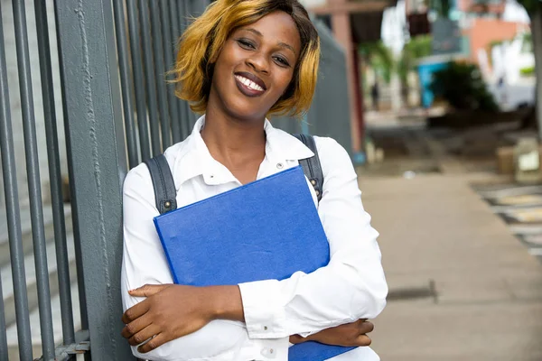 Portrait of smiling university student standing outside on the r — Stock Photo, Image