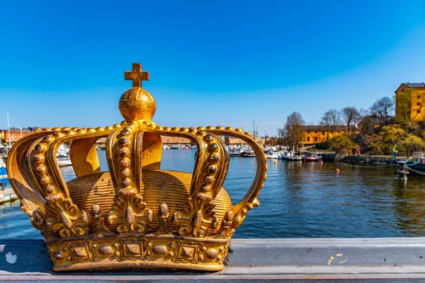 Stockholm viewed behind an ornamental golden crown on the Skepps — Stock Photo, Image