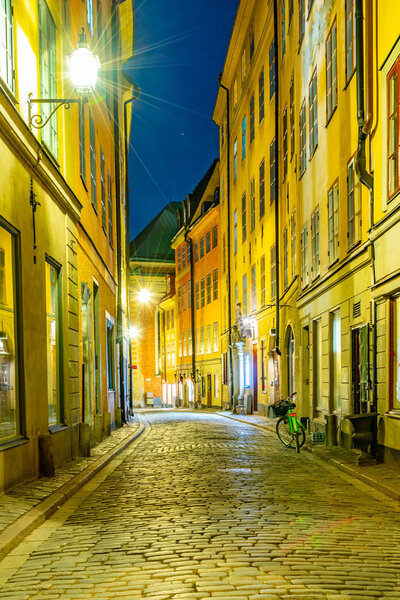 Night view of a narrow street in the Gamla Stan district in central Stockholm, Sweden.