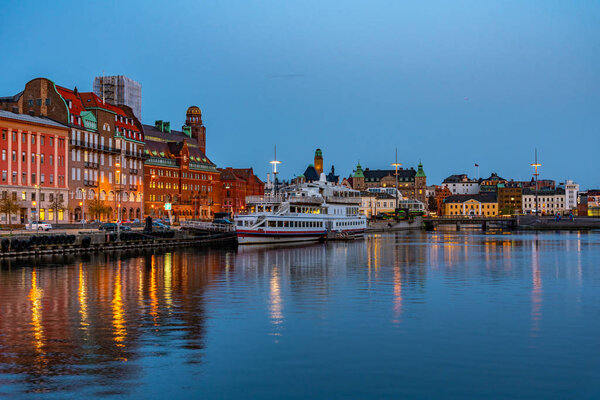 Sunset view of waterfront alongside a channel in Malmo, Sweden