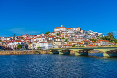 View of cityscape of old town of Coimbra, Portugal clipart