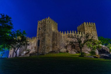Sunset view of Guimaraes castle in Portugal clipart