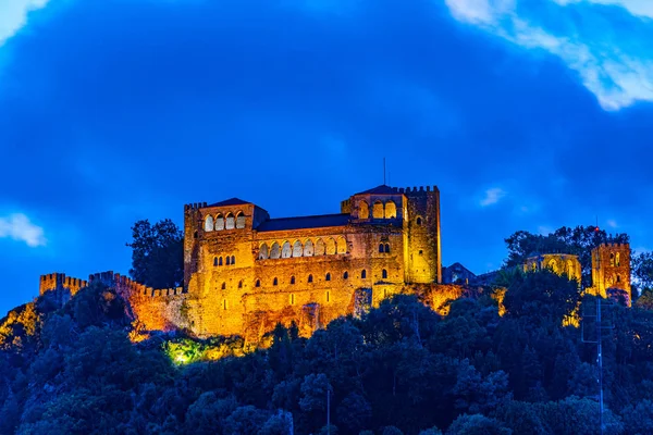Sunset view of Leiria castle overlooking the old town, Portugal