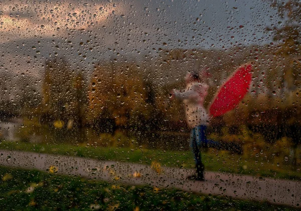 Girl with a red umbrella