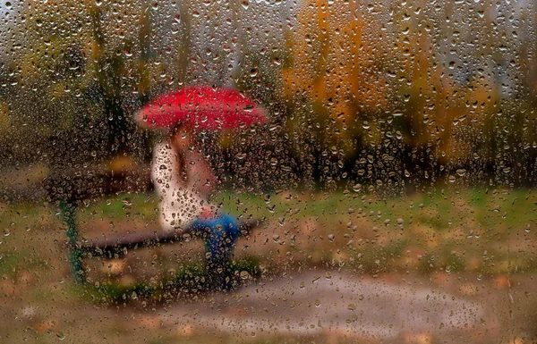 Girl with a red umbrella