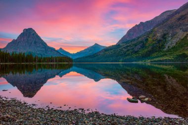 Sinopah Mountain and its reflection in Two Medicine Lake.Glacier
